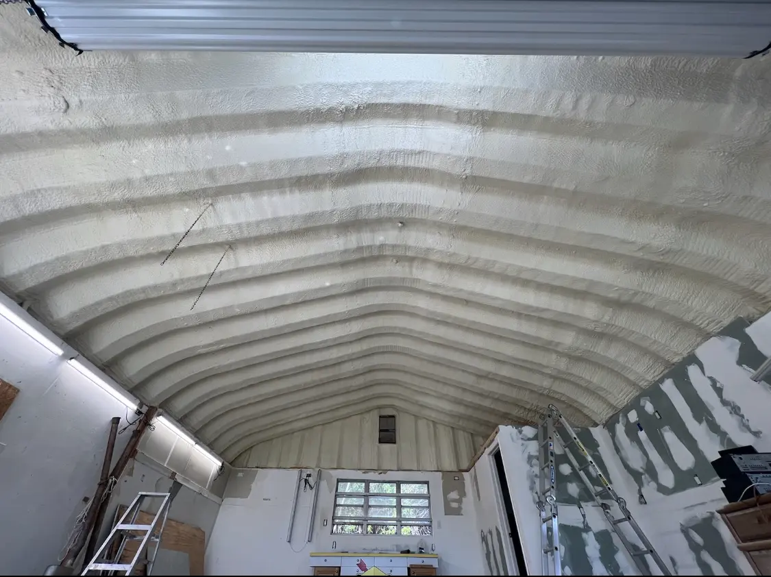 Spray polyurethane foam applied to the underside of a metal roof deck in Herndon